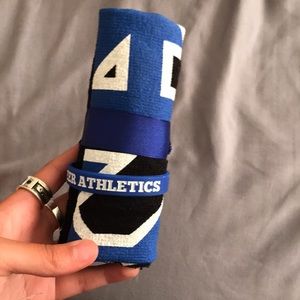 Cheer Athletics fan towel and rubber bracelet